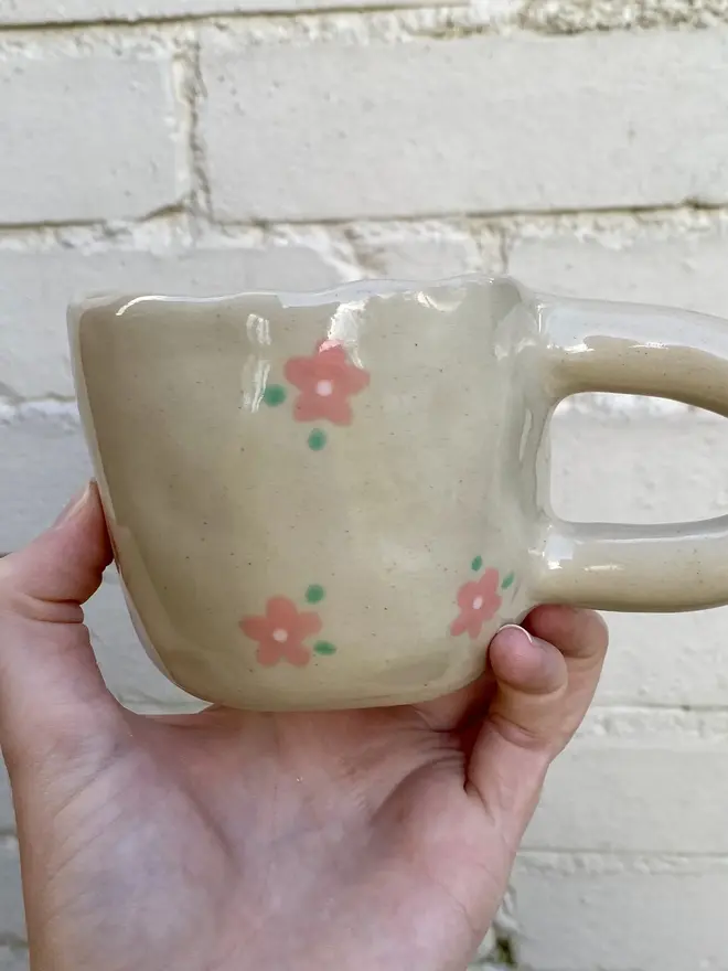 pink flower painted handmade ceramic smiley face mug