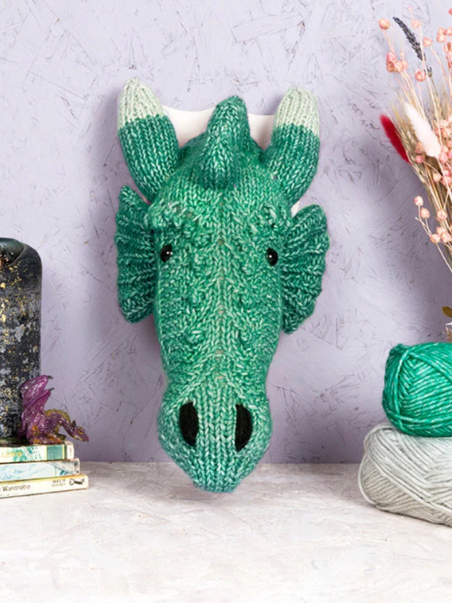 Dragon Head Knit Kit. A mini green dragon head.