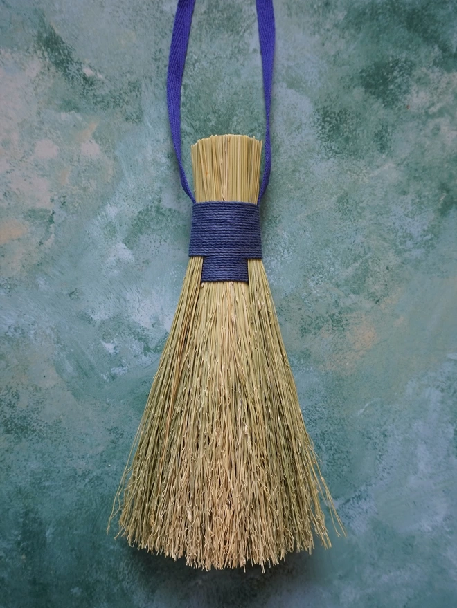 Handmade broomcorn bundle brush with blue hemp cord binding