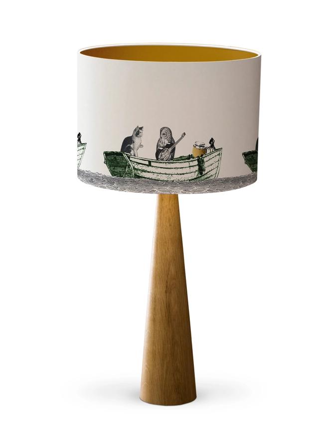 Handcrafted Owl and the Pussycat lampshade featuring a whimsical pea green boat illustration, bringing a touch of nostalgic storybook charm to the home.