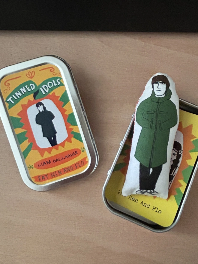 Mini illustrated fabric dolls of Oasis frontman Liam Gallagher.