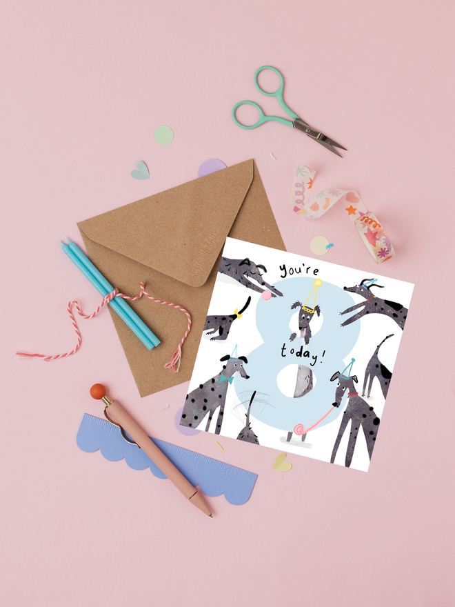 '8 today' illustrated birthday card. card featuring big number 8 and illustrated grey dogs.