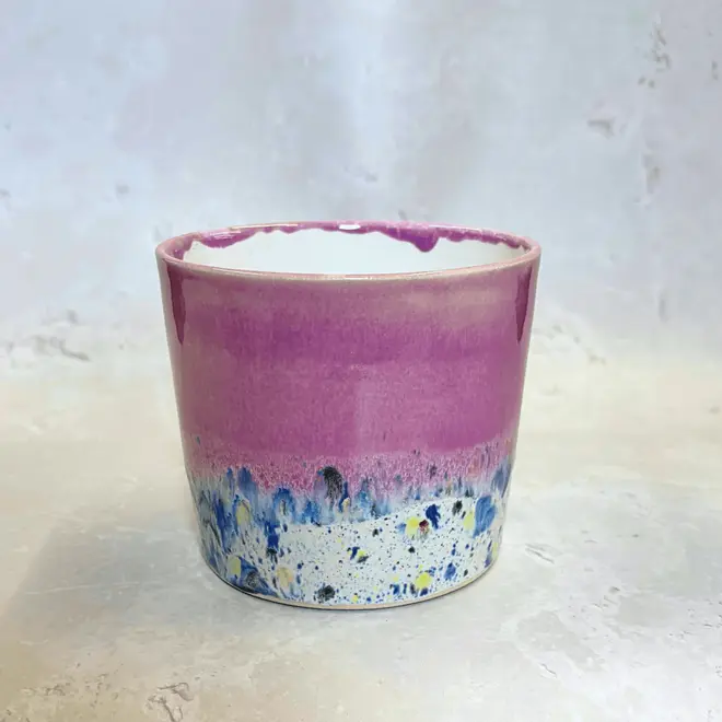 Shoreline Large Pot, a colourful pot placed on a stone surface. 