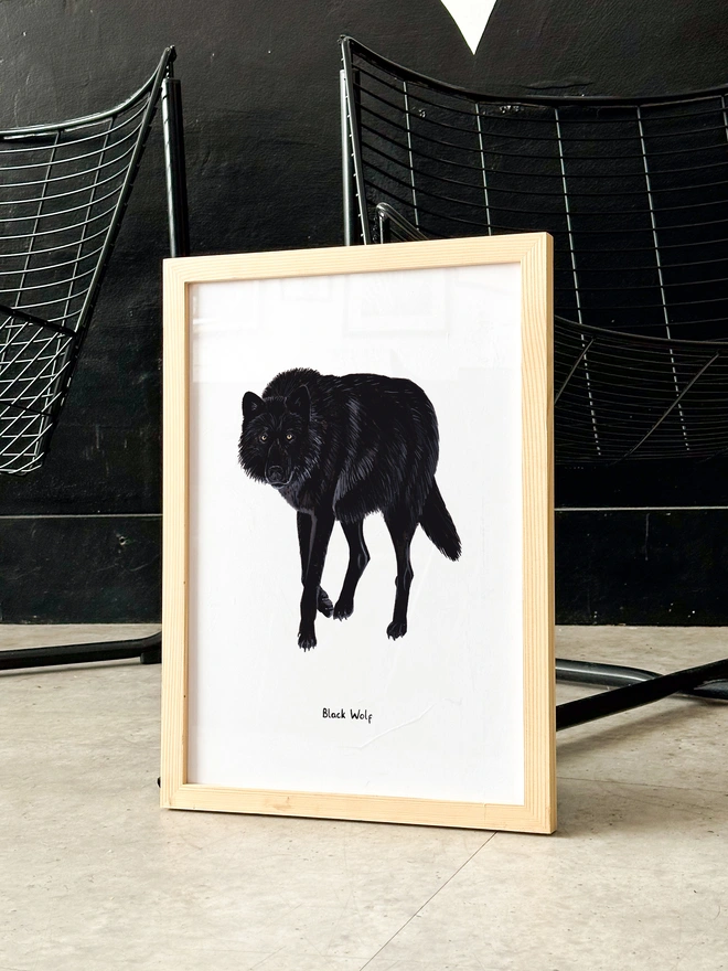 a print featuring a black wolf illustration