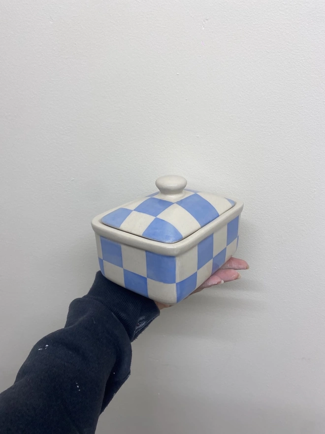  Checkered Blue & Cream Handmade Ceramic Butter Dish, a blue patterned butter dish held against a white backdrop. 