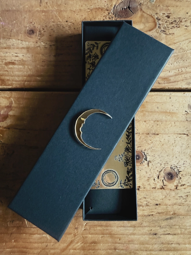 Luxury black gift box with mirror moon adornment. 