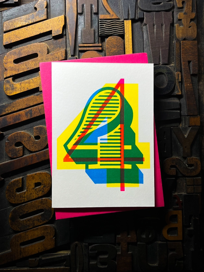 4th birthday anniversary milestone typographic letterpress card with deep impression print. Very colourful and vibrant. They show slight colour variations adding to the style anding to the charm of this handmade greeting card.