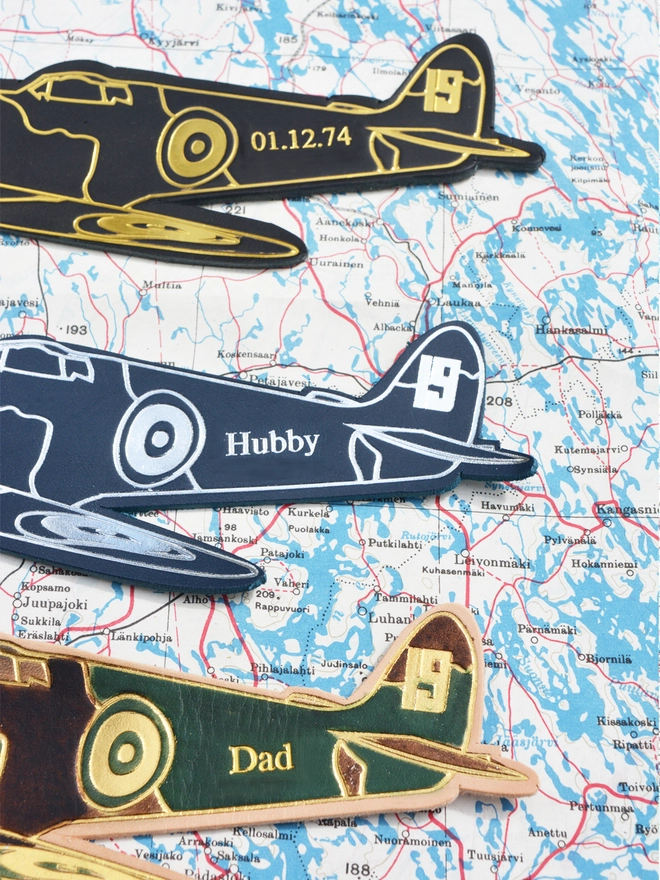 3 leather spitfire bookmarks in black and gold blue and silver and a hand painted coloured option