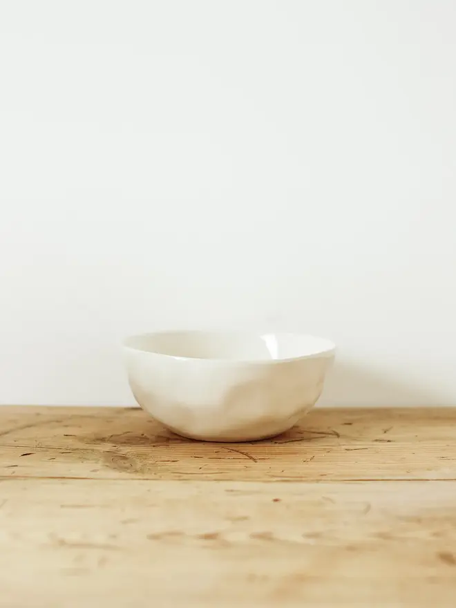 stoneware place setting dining set. a white stoneware bowl.