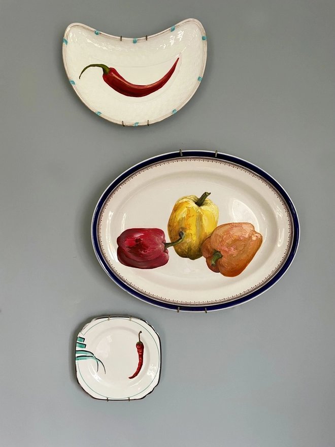 decorated plates on grey wall