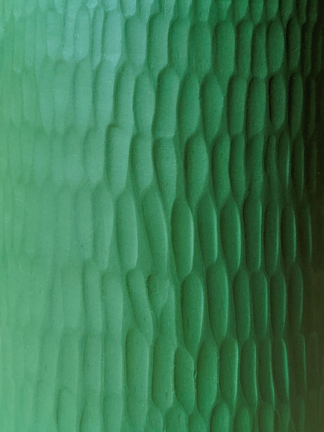 handmade textured dark green vase with close up