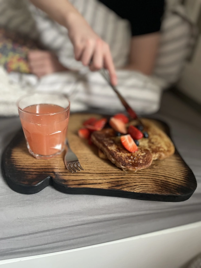 Toast in bed ..pancakes and strawberries on a toast shaped serving board