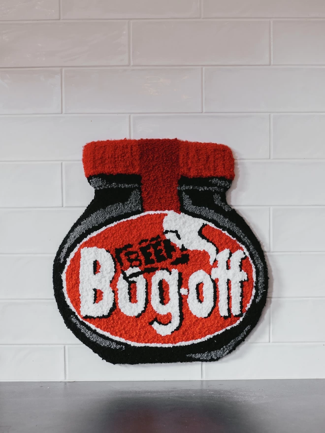 'Bog Off' Handmade Tufted Rug/Wall Hanging seen hanging above a kitchen counter.