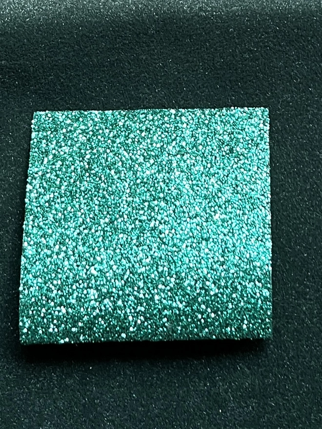 emerald glitter on forest green
