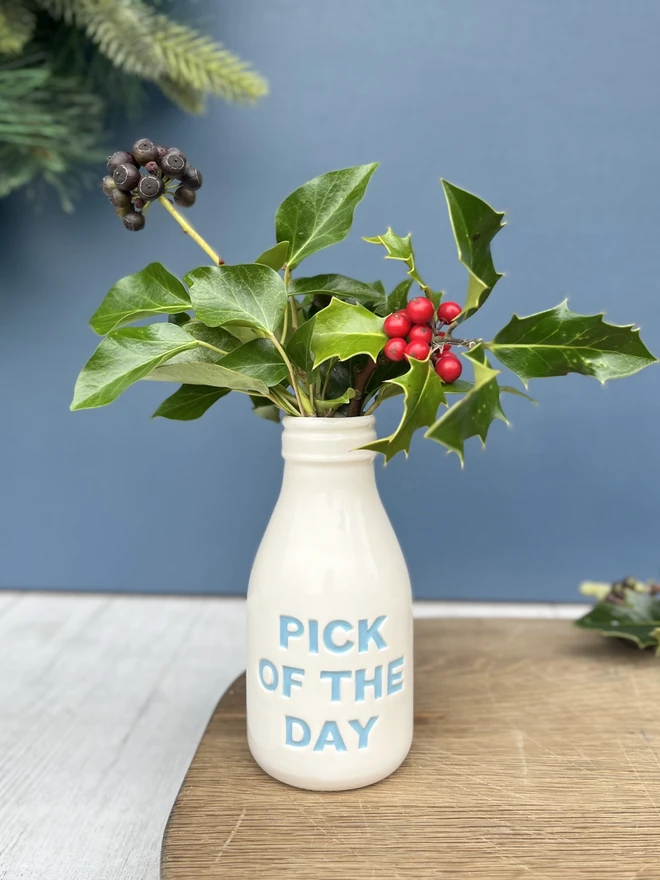 Handmade pick of the day bottle filled with holly and ivy