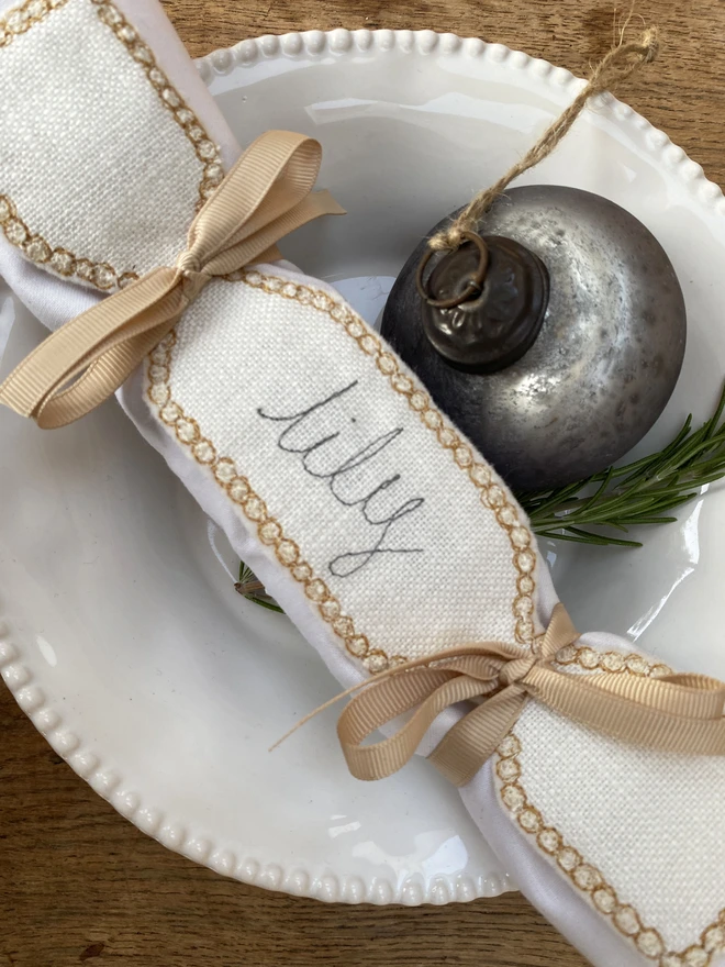 Fabric Cracker Napkin Decoration on plate with bauble