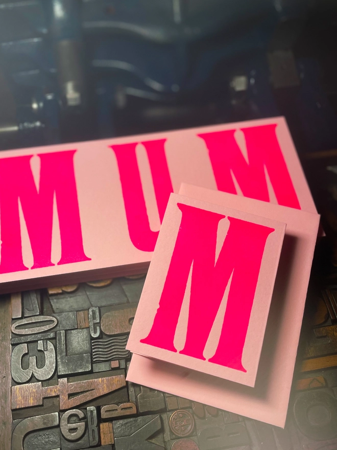 An artisan Mother’s Day concertina card printed in bold Runic Grotesque type using fluorescent pink ink on thick GF Smith Colorplan Candy Pink card, letterpress printed with a deep impression.