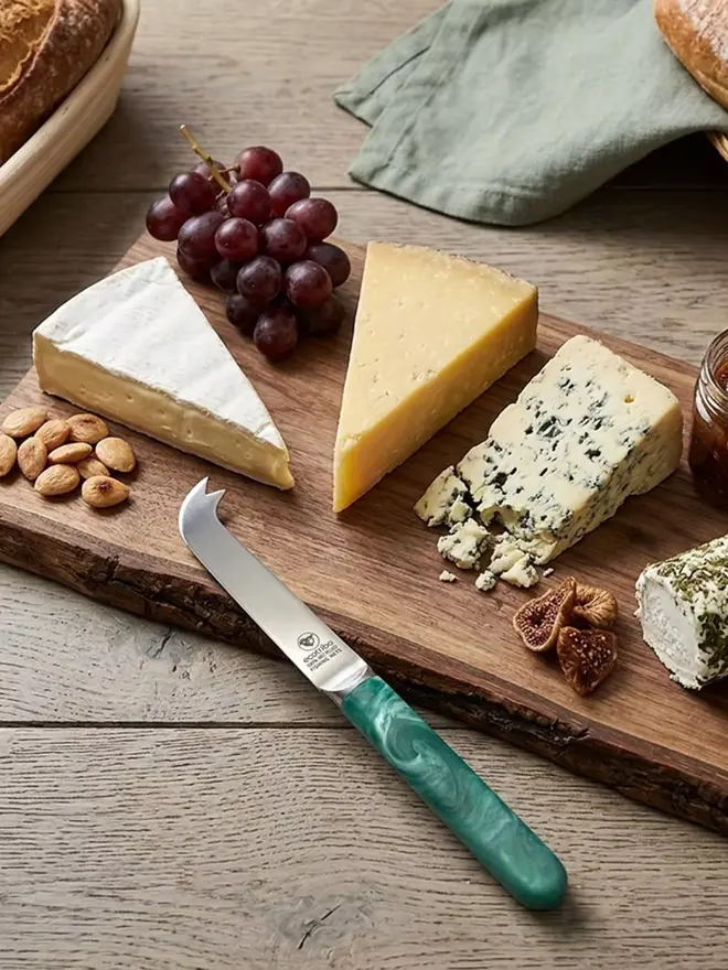 Recycled ocean plastic eco cheese knife handcrafted in the UK from recovered ghost fishing nets.