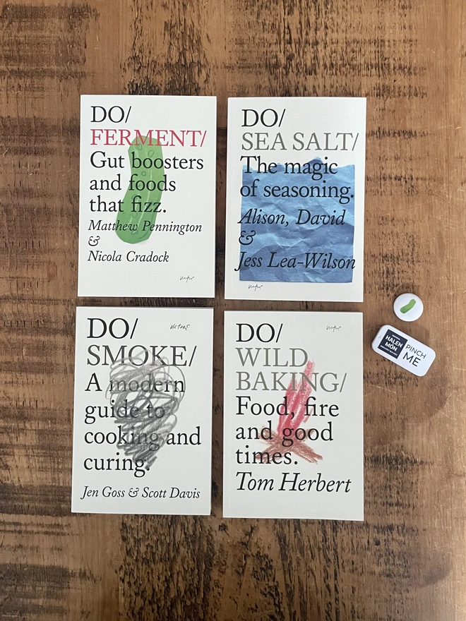 4 books on wooden table