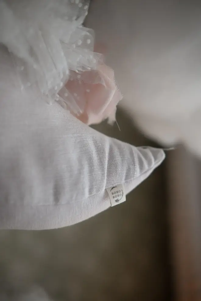 Sleepy Moon Nursery Pillow Hanging Decoration, a hanging pillow decoration suspended in a bedroom. 