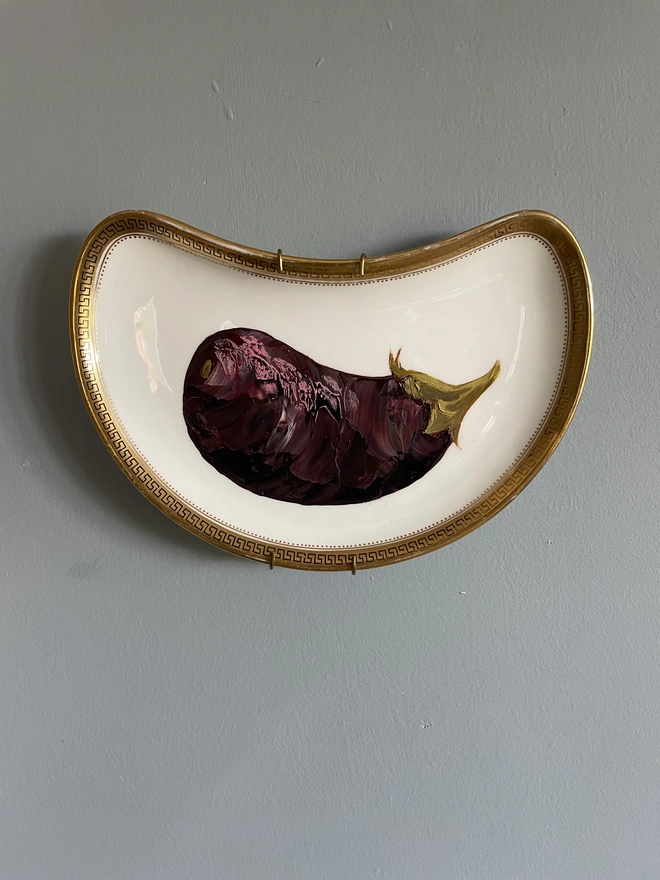 aubergine oil painting on moon shaped plate