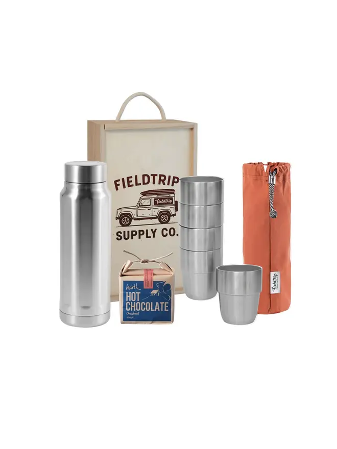 land rover cups and flask gift set. a wooden box containing 5 stainless steel cups in a  orange cloth bag, a box of hot chocolate and a stainless steel flask.