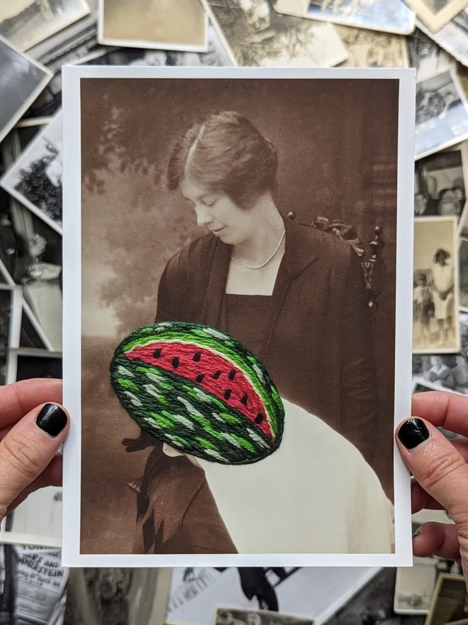 B&W photo print of woman holding embroidered watermelon’ held against vintage photos