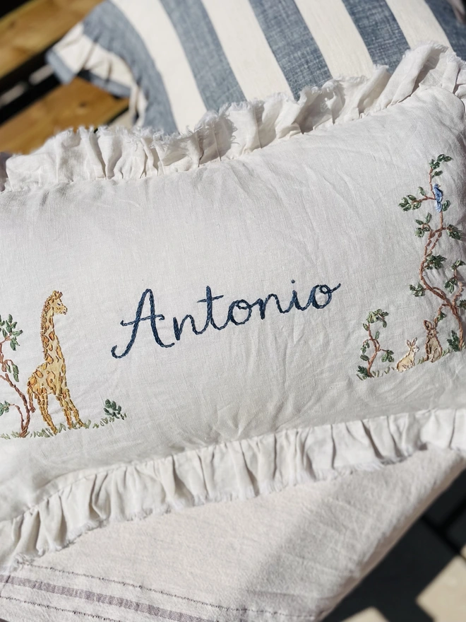 Soft Linen personalised cushion with giraffe and bunny motif - blossom and bramble embroidery