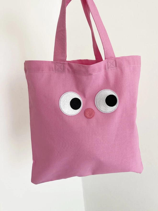 tote bag customised with eye patches 