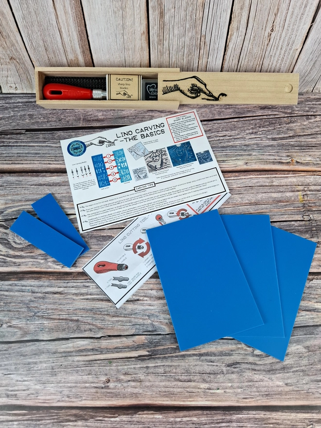 Lino carving and printing kit in wooden box with blue soft lino and versicolor ink pad