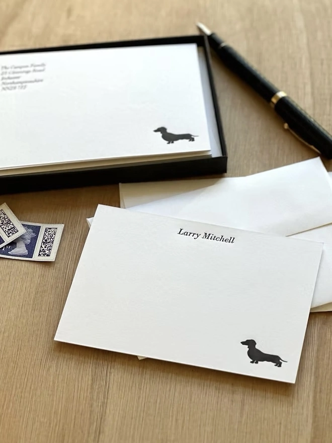 Personalised Dachshund Correspondence Cards (Set Of 10, 20),  golden dachshund icon in corner of white correspondence letter with name personalisation and white envelopes in background. 