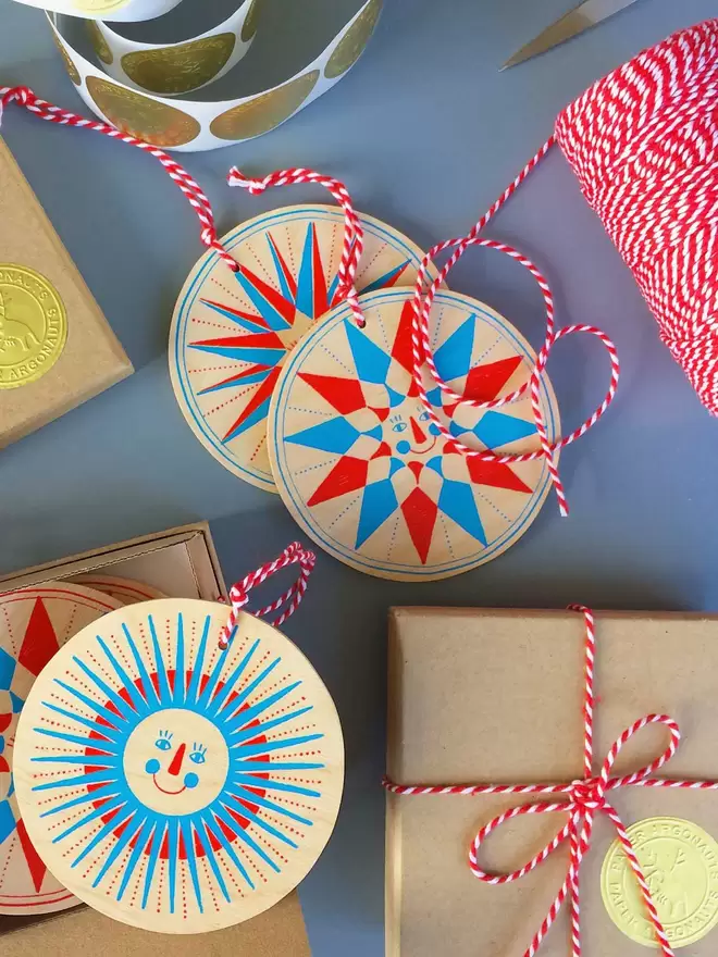 The star decorations are being packed up, wrapped in boxes and tied with red and white ribbon 