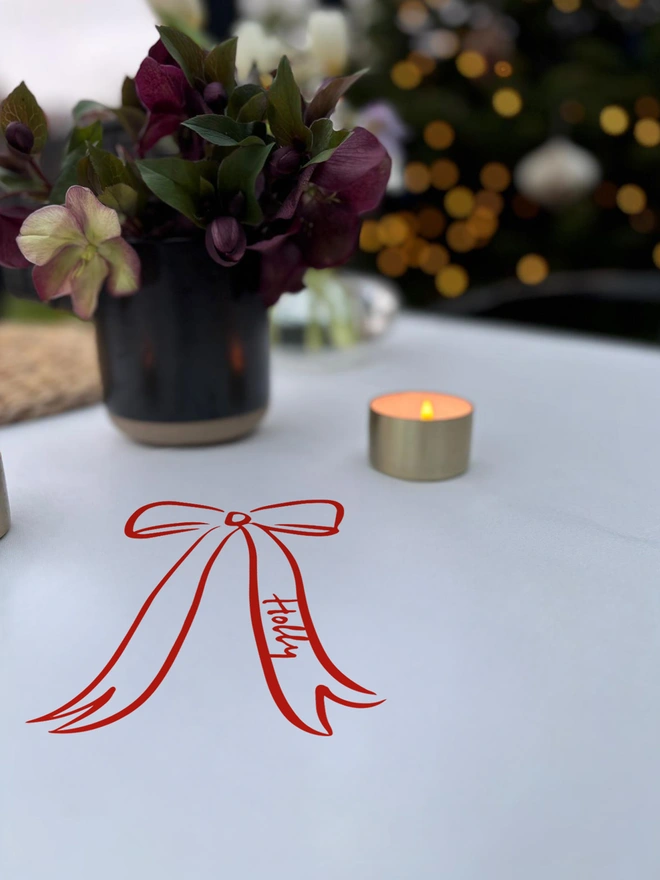 Bow tablecloth sticker red on a white tablecloth