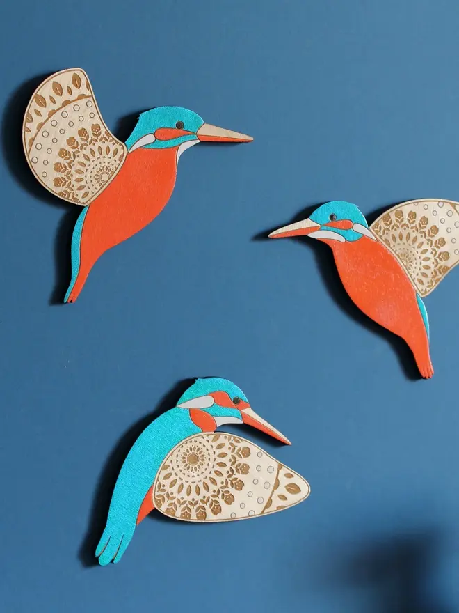 Folk Art Wooden Kingfishers (Set Of 3), wooden kingfishers hanging flying on a wall. 