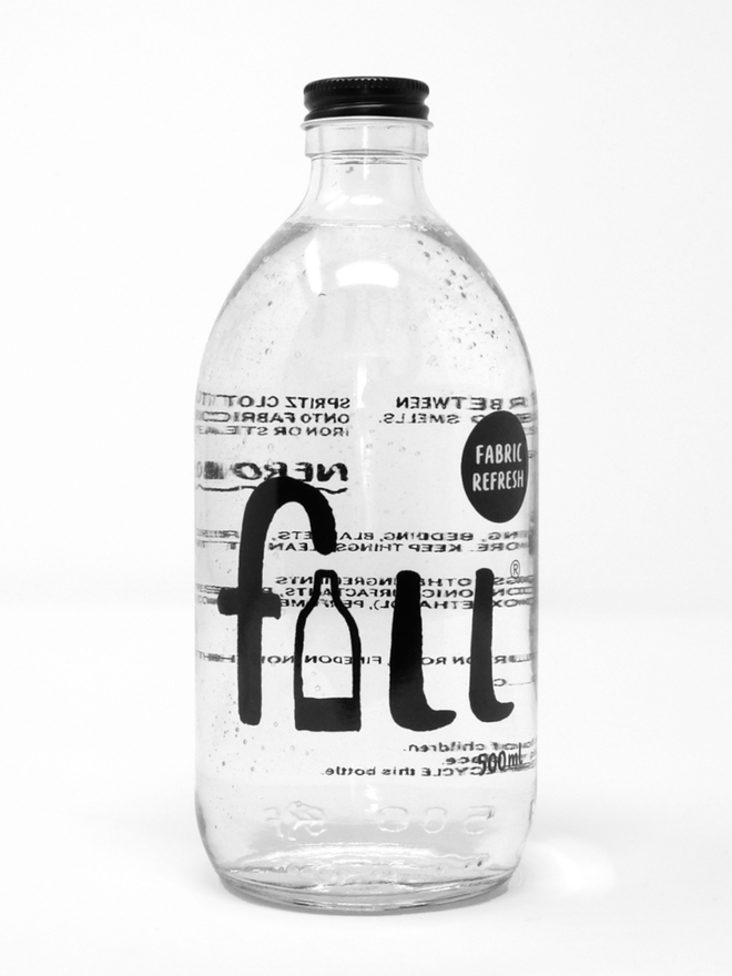 Fabric Refresh. A clear white bottle labelled Fill Fabric Refresher.
