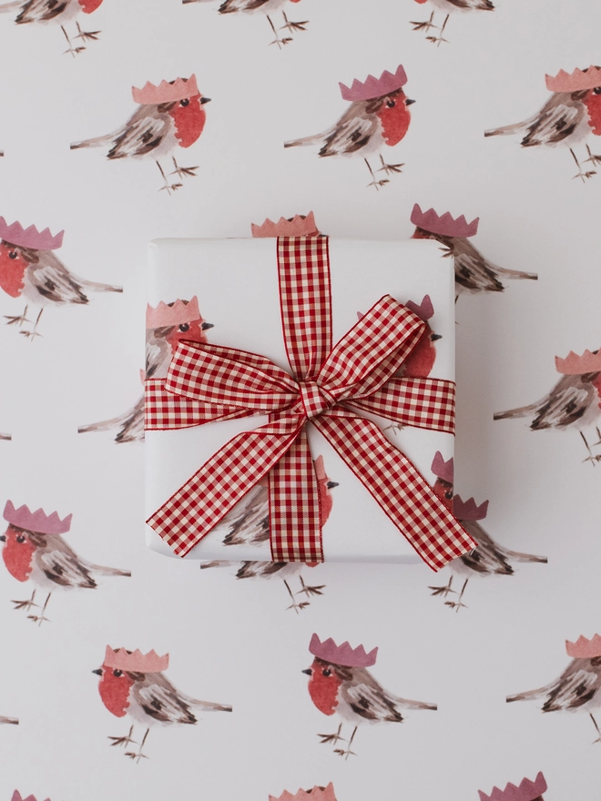 white background robin in christmas hat wrapping paper