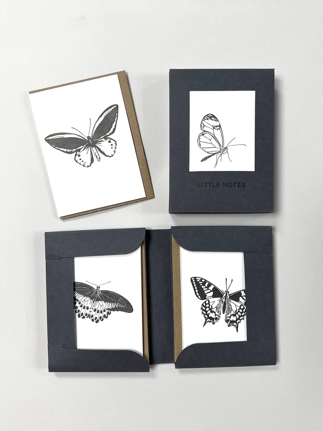 Open and closed gift boxes for little notes allowing you to see three of the four designs in one box