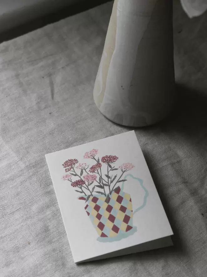 floral greetings card with yarrow in a harlequin jug.