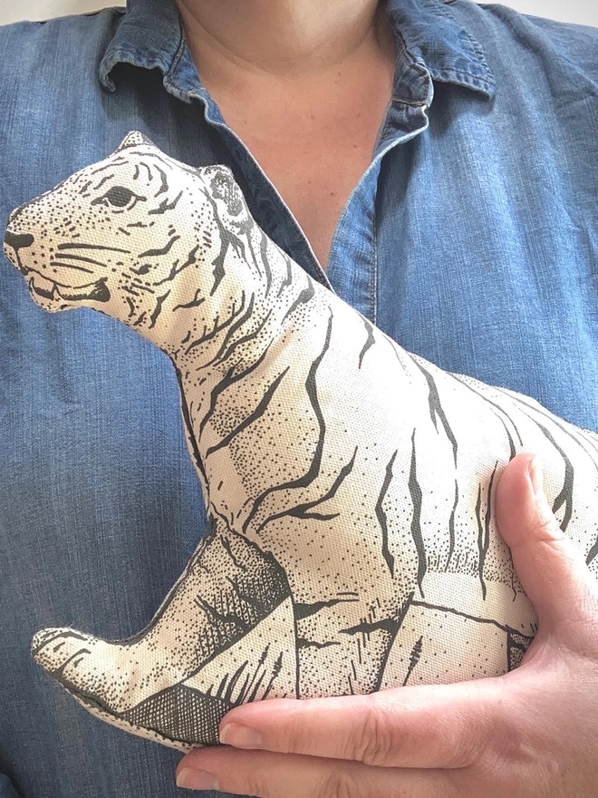 tiger tea towel held