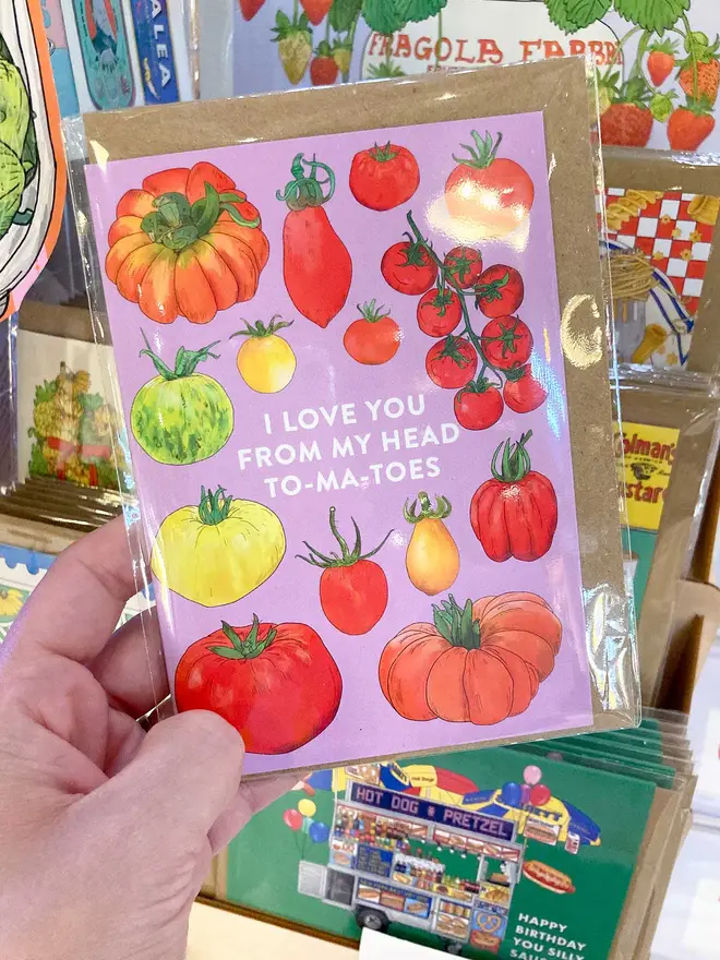 Food-inspired illustrated greeting card featuring a colourful collection of tomato variations, set against a bold purple background. A vibrant and playful design perfect for food lovers and those who appreciate fresh, farm-to-table aesthetics