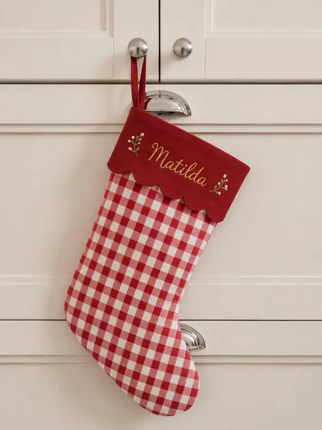 red stocking with scalloped top and personalised embroidery