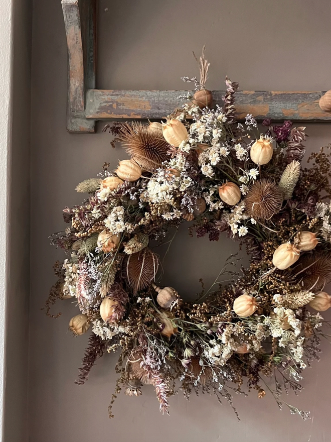 Winter Wreath. A wreath made of winter plants, hung on a wall.
