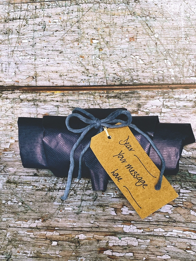 A gift wrapped flag in blue paper