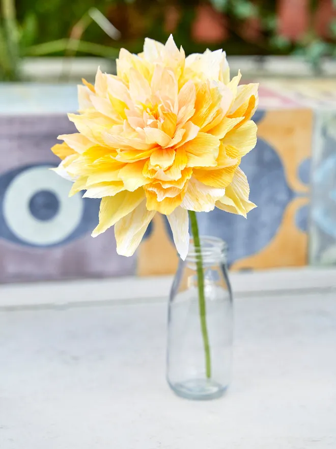 Yellow crepe paper flower