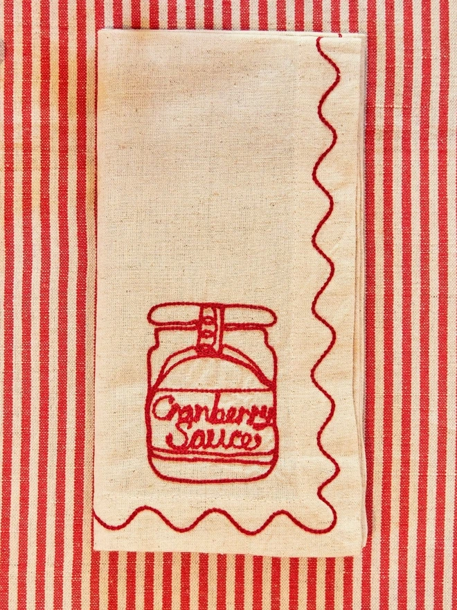 Embroidered cranberry sauce napkin