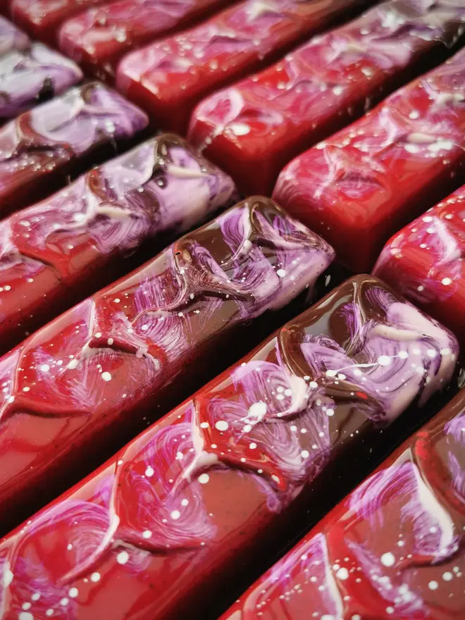 pink and purple chocolate bar with white paint splatter decor