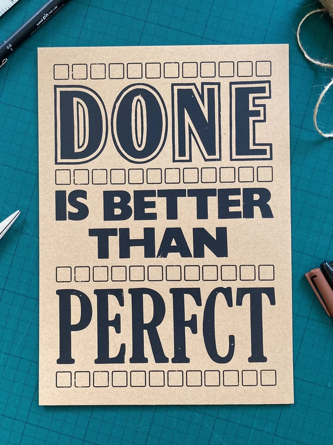 Done is better than Perfct Screen Print (blank ink on brown paper)