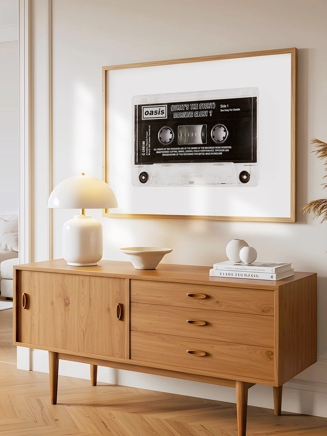 oasis whats the story morning glory cassette tape print. framed print hung up above wooden dresser.