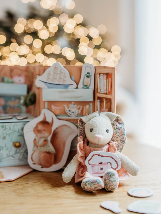 Betsy Bunny inside her woodland tree stump shop.  With her woodland animal friends and lots of prompts for imaginary play.