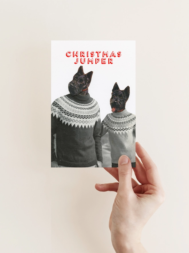 A funny dog card featuring two Scottish Terriers wearing Fairisle Christmas jumpers.